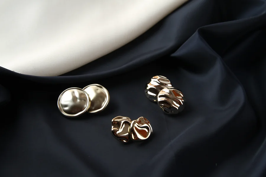 Dark fabric and metal garment accessories from the BHR collection