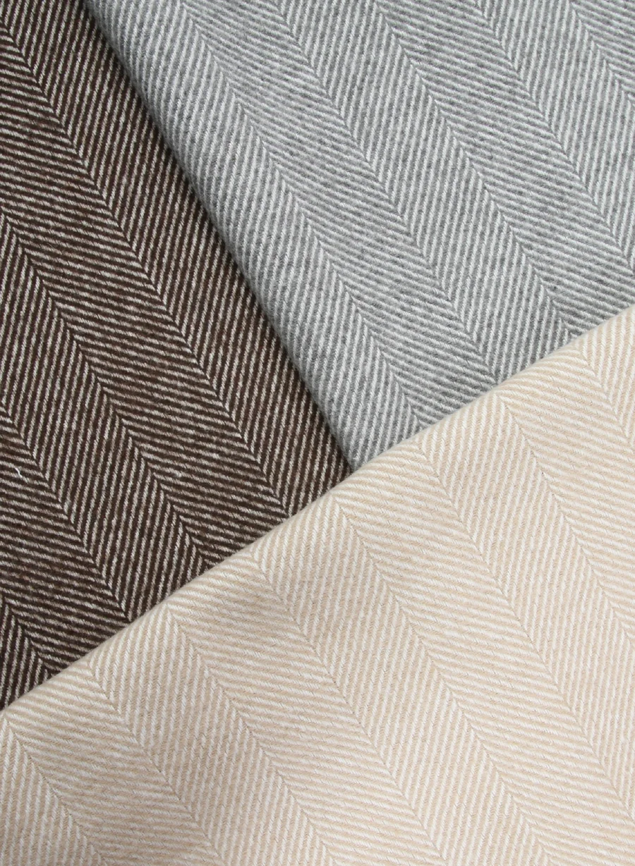 Neutral herringbone textiles in a client-supplied photograph