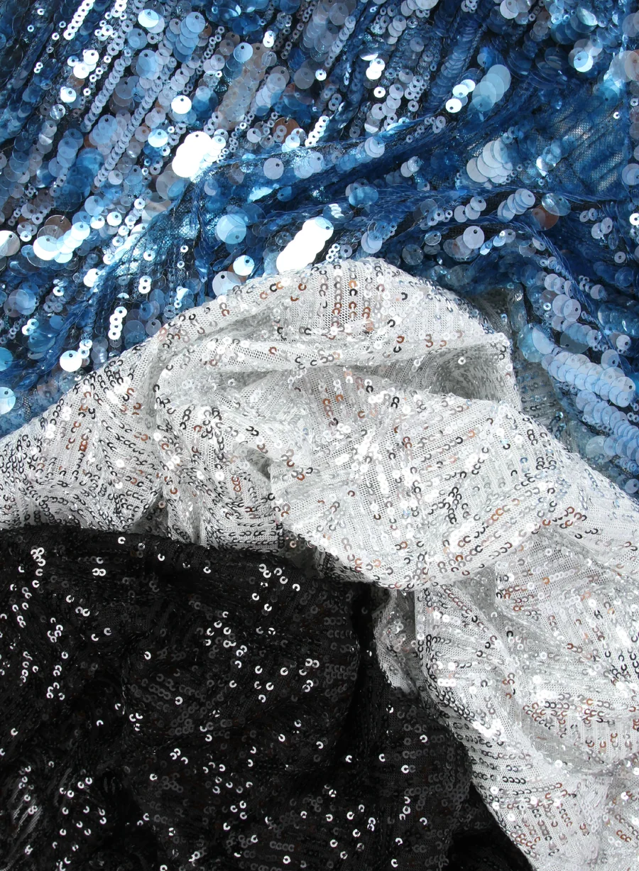 Blue, white and black sequined textiles in a client-supplied photograph