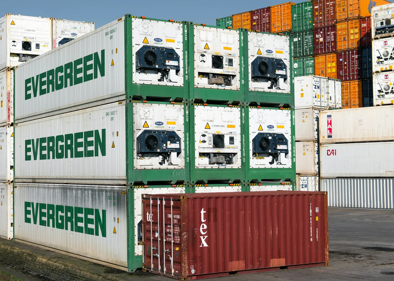 Stacked freight containers, illustrative photography